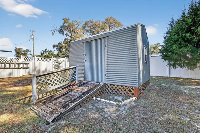 a view of a wooden fence with a bench