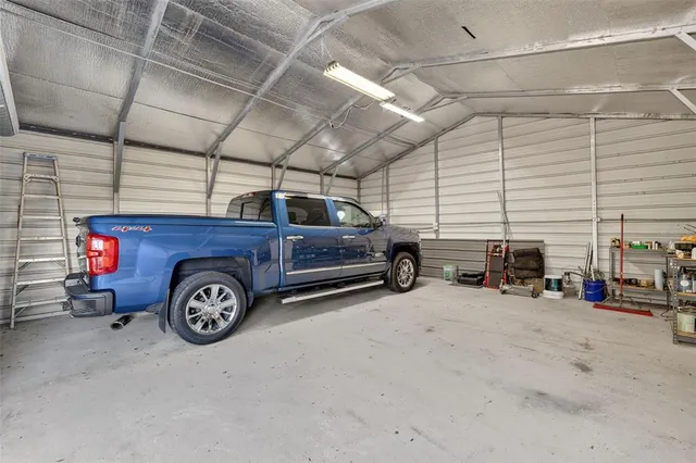 a view of a garage and car parked