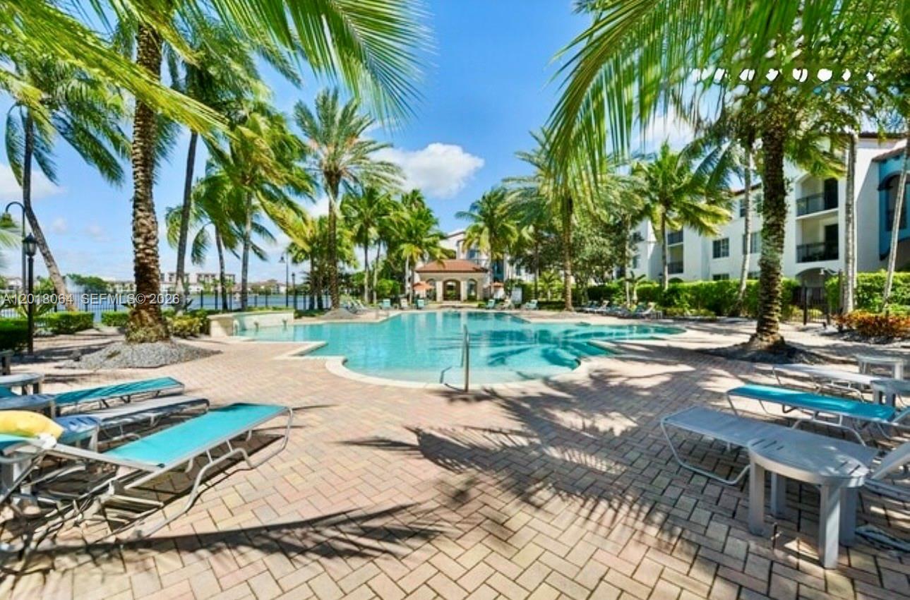 16213 Emerald Cove Road Weston, FL 33331 - Photo 24 of 27 a view of a park with swings and slides