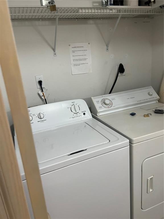 8713 Rockingham Terrace, Unit D Kissimmee, FL 34747 - Photo 13 of 14 a utility room with dryer and washer