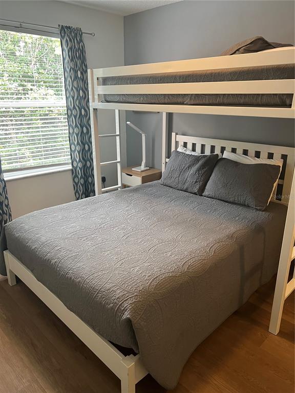 8713 Rockingham Terrace, Unit D Kissimmee, FL 34747 - Photo 10 of 14 a bed sitting in a bedroom next to a window