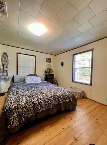 a bedroom with a bed and a closet