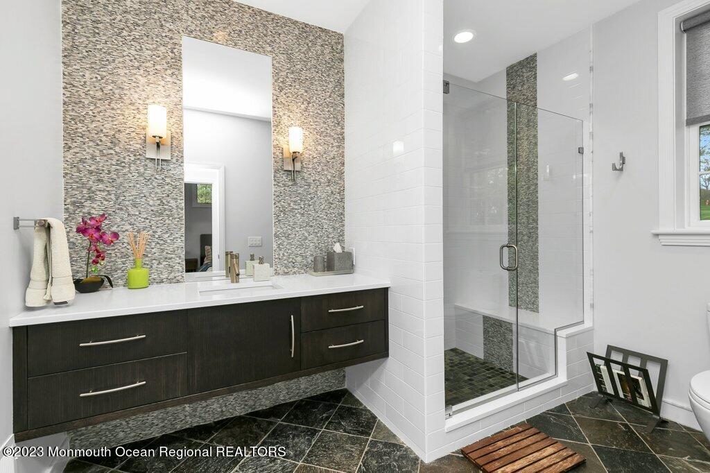 17 Club Way Red Bank, NJ 07701 - Photo 15 of 72 a bathroom with a sink and a mirror