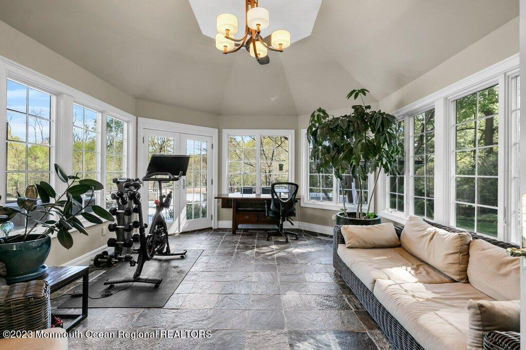 17 Club Way Red Bank, NJ 07701 - Photo 21 of 72 a living room with furniture floor to ceiling window and a flat screen tv