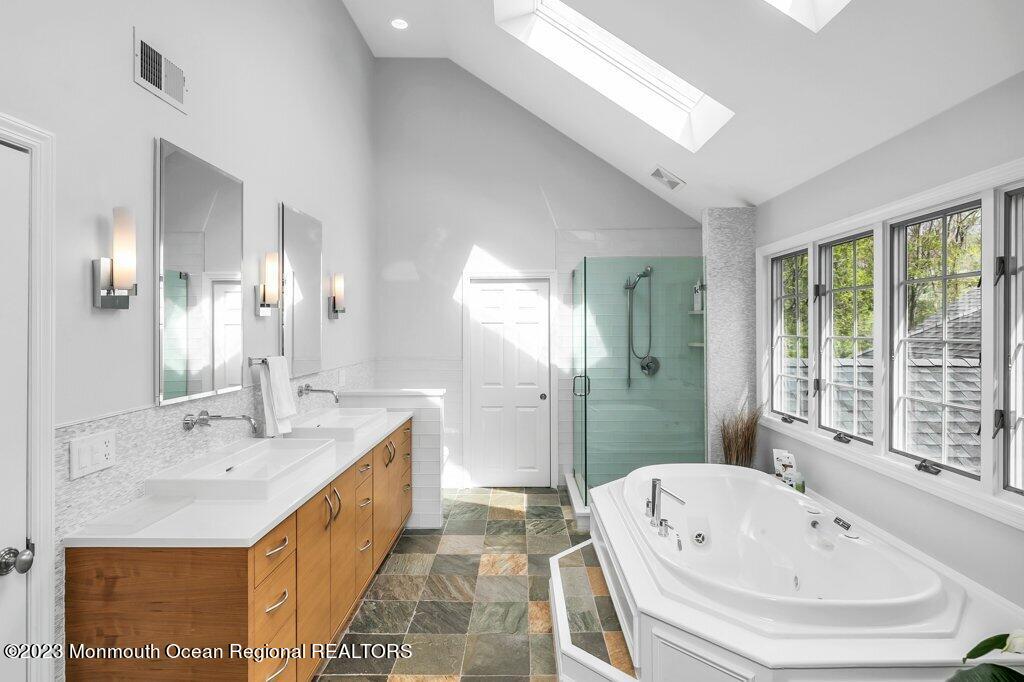 17 Club Way Red Bank, NJ 07701 - Photo 28 of 72 a bathroom with a tub sink and mirror