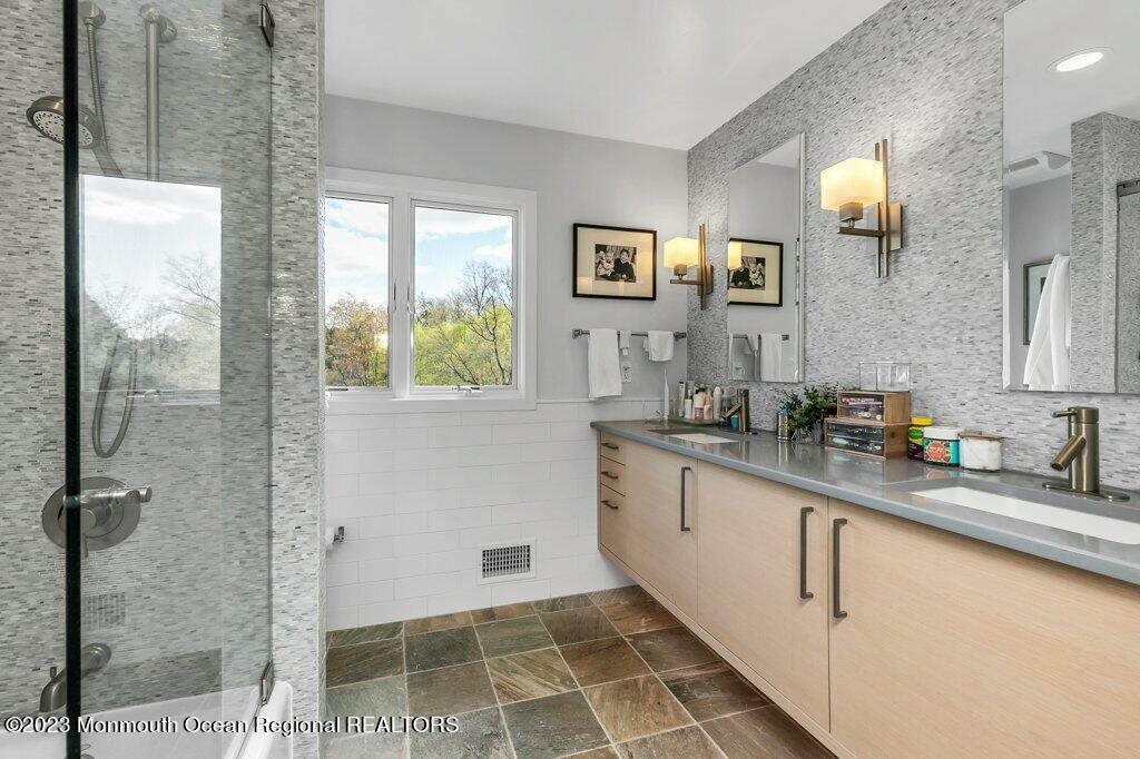 17 Club Way Red Bank, NJ 07701 - Photo 32 of 72 a bathroom with a double vanity sink and a mirror