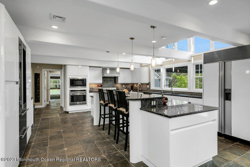 17 Club Way Red Bank, NJ 07701 - Photo 8 of 72 a kitchen with stainless steel appliances granite countertop a stove refrigerator and a sink