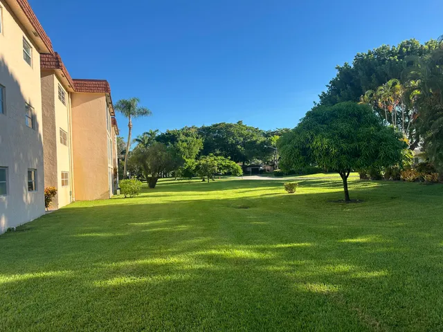 a view of a house with a big yard