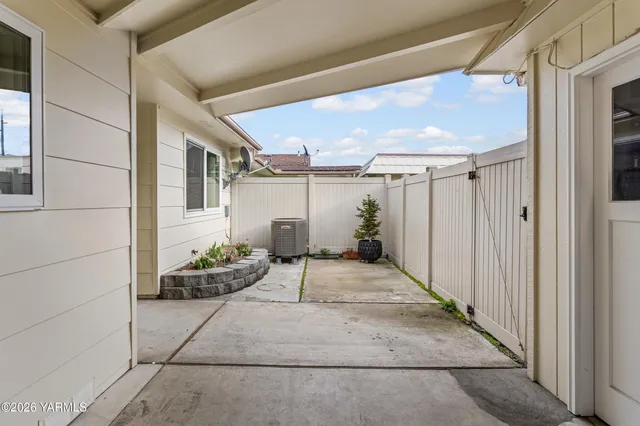 a view of a porch with potted plants