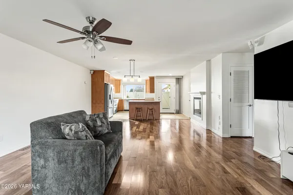 a living room with furniture and a flat screen tv