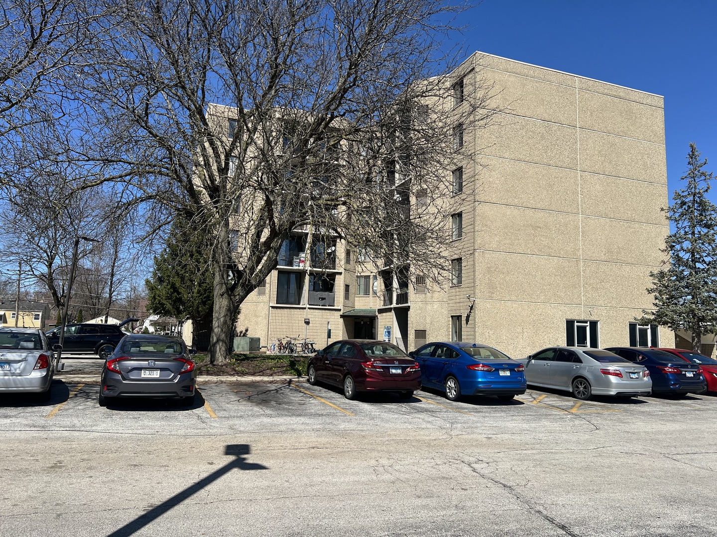 1750 North Marywood Avenue, Unit 315 Aurora, IL 60505 - Photo 18 of 20 a cars parked in front of a building