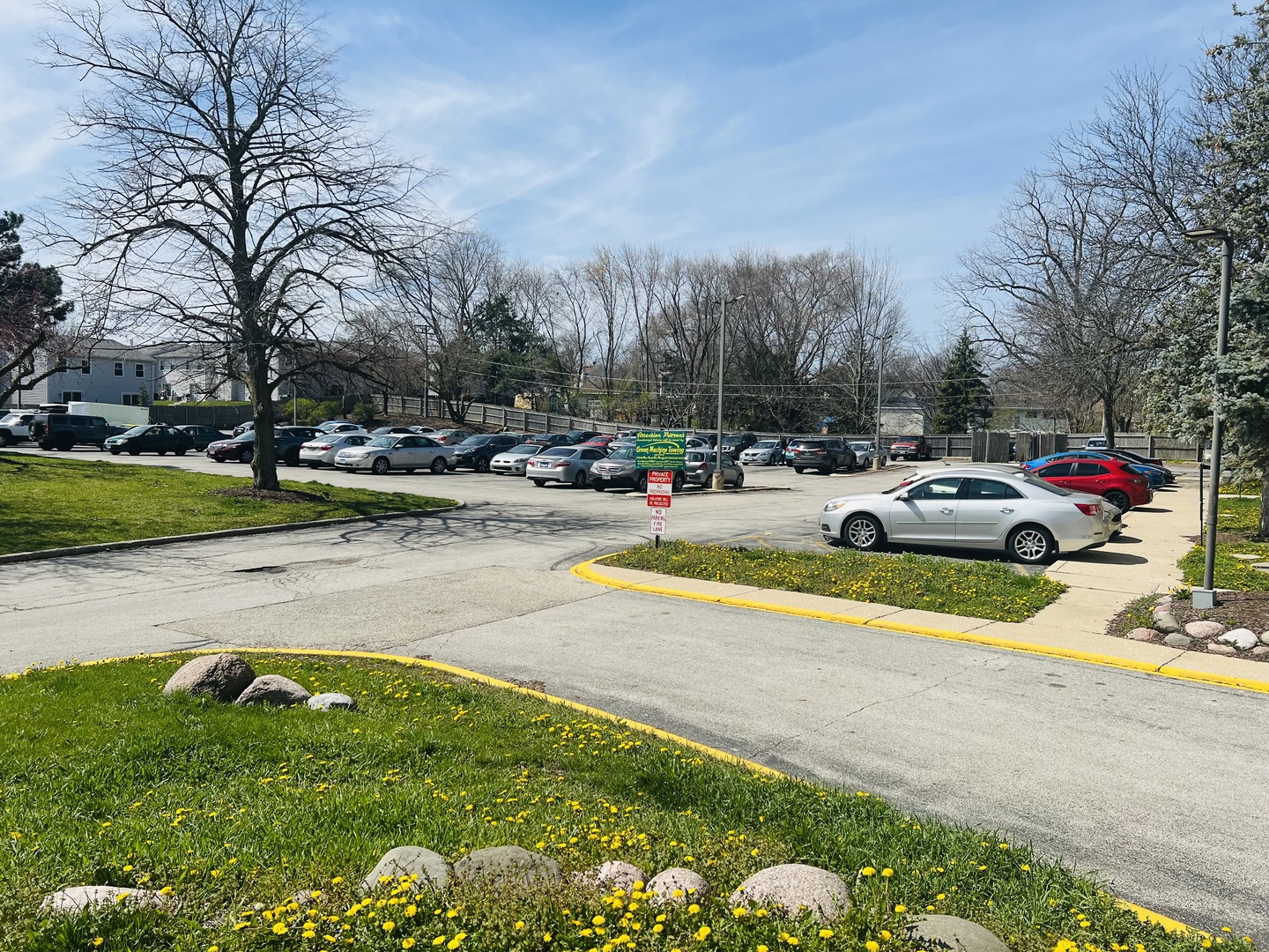 1750 North Marywood Avenue, Unit 315 Aurora, IL 60505 - Photo 19 of 20 a view of a swimming pool with a lounge chair and trees in the background