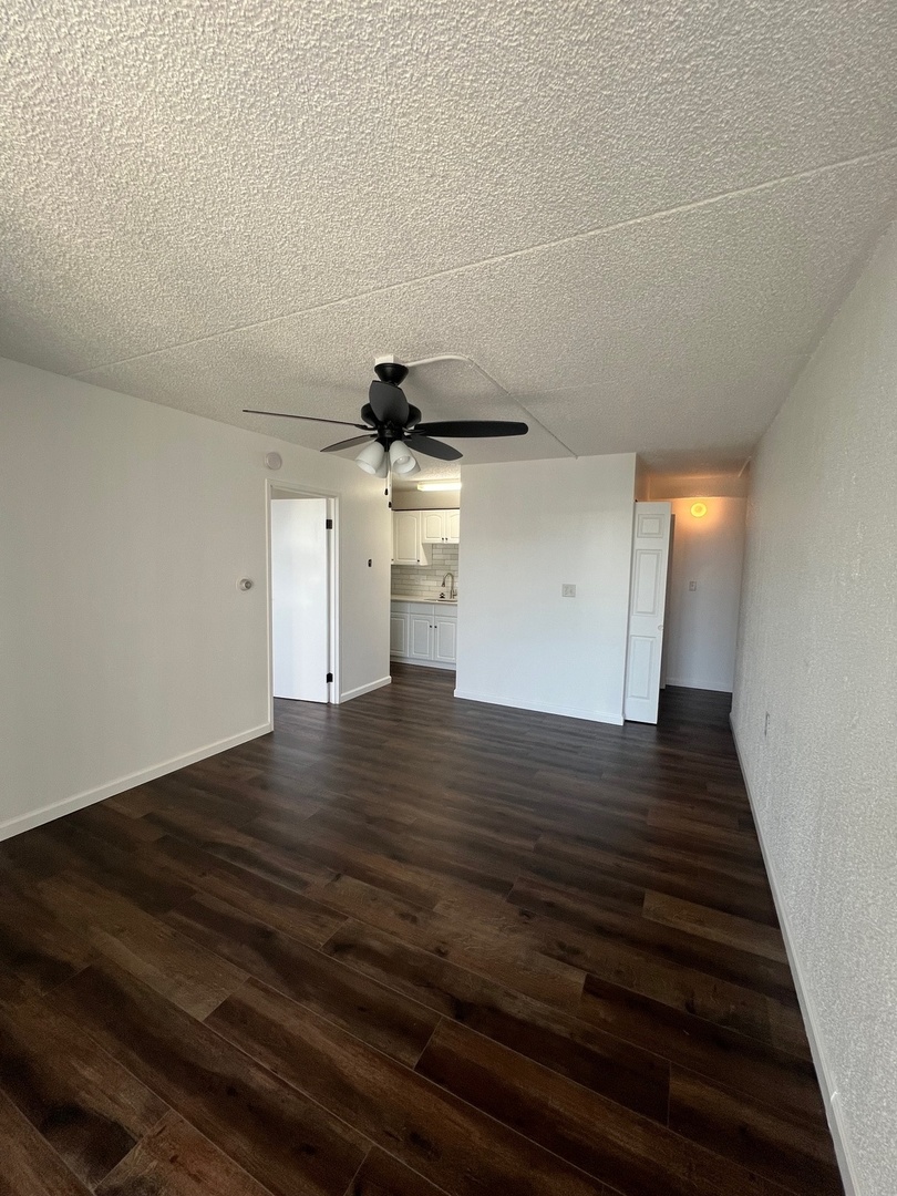 1750 North Marywood Avenue, Unit 315 Aurora, IL 60505 - Photo 6 of 20 a view of an empty room with wooden floor