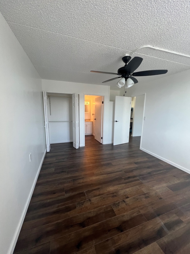 1750 North Marywood Avenue, Unit 315 Aurora, IL 60505 - Photo 8 of 20 a view of an empty room with wooden floor and a window