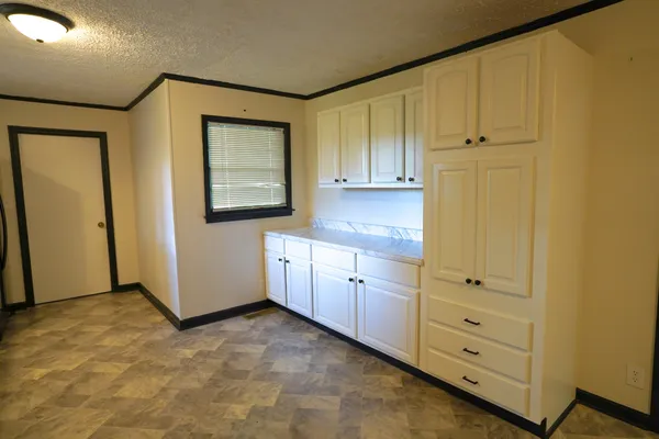 a view of a hallway with closet