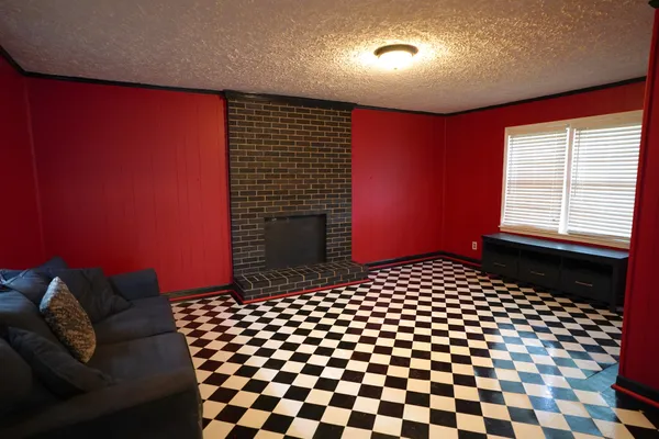 a bedroom with a bed and a black door