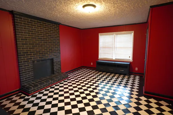 a bathroom with a black white checkered floor
