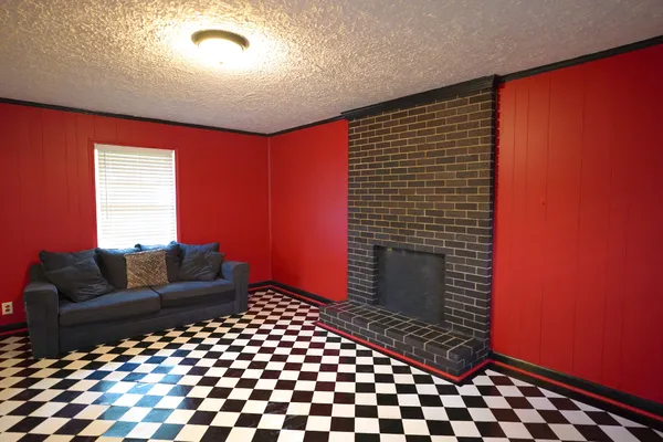 a living room with a couch and a rug