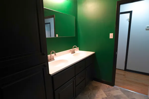 a bathroom with a sink and mirror