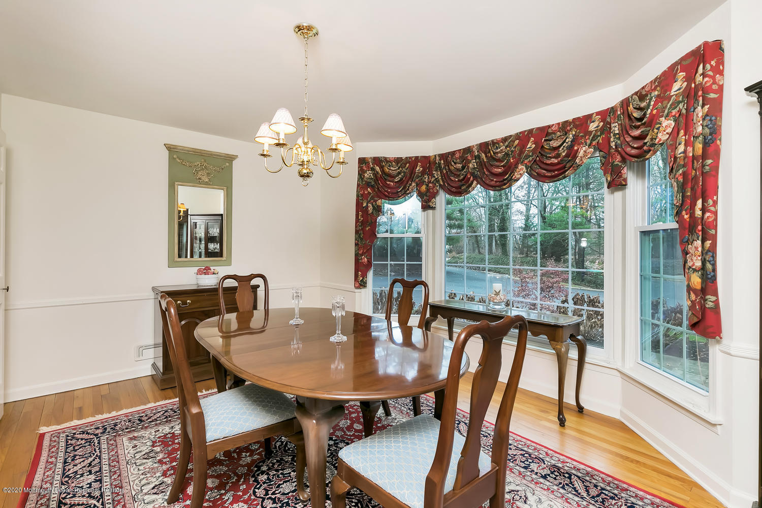 1 Berkeley Square Brielle, NJ 08730 - Photo 13 of 28 a view of a dining room with furniture wooden floor and a chandelier