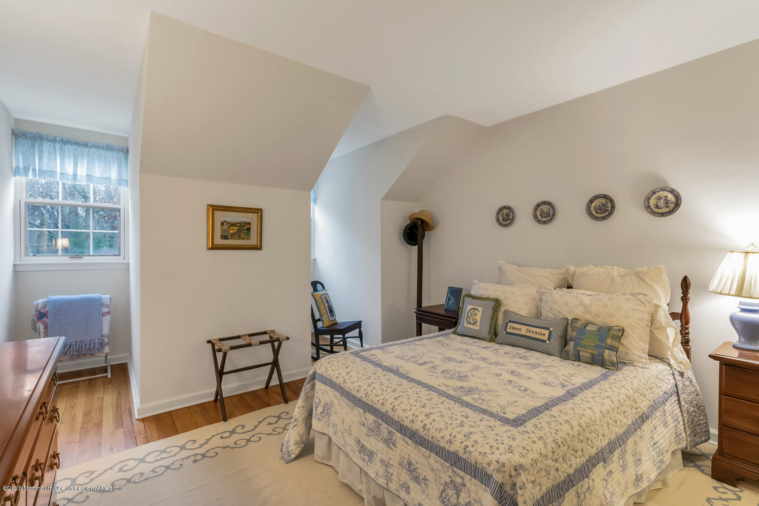 1 Berkeley Square Brielle, NJ 08730 - Photo 21 of 28 a bedroom with a bed and a table in it