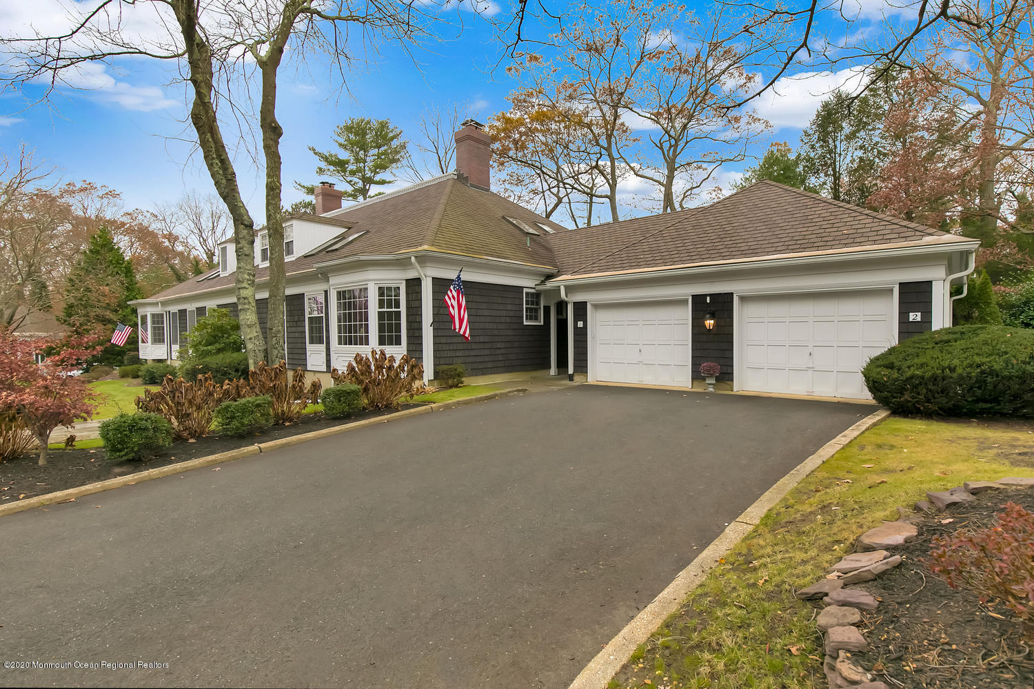 1 Berkeley Square Brielle, NJ 08730 - Photo 26 of 28 a front view of a house with a yard and garage