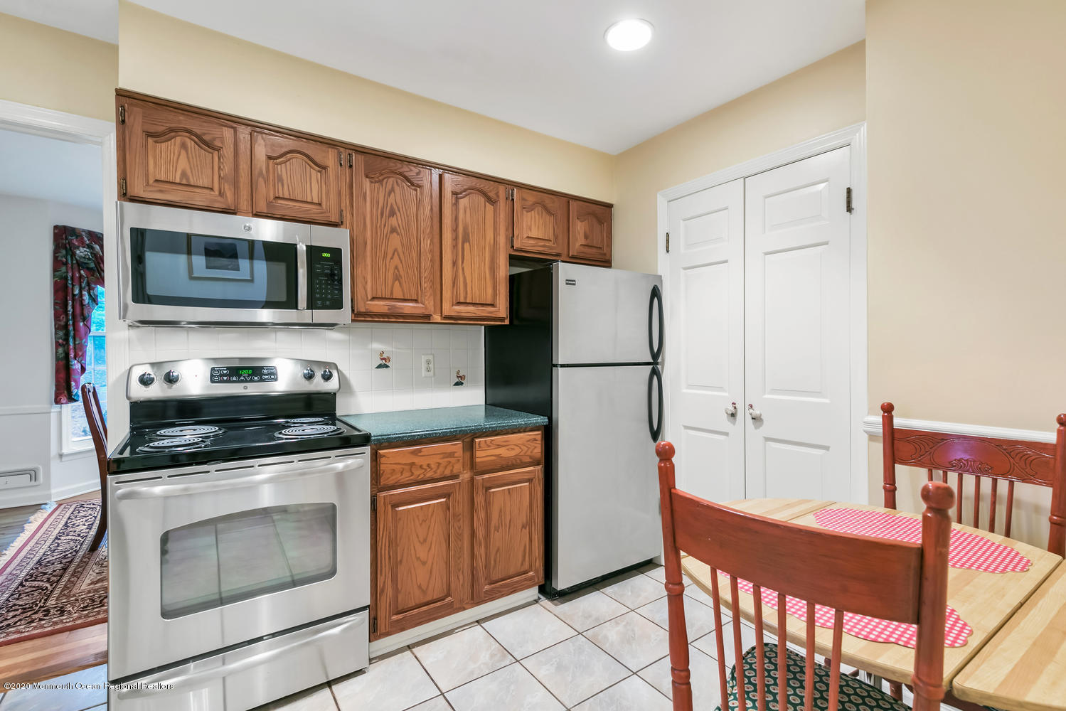 1 Berkeley Square Brielle, NJ 08730 - Photo 6 of 28 a kitchen with stainless steel appliances granite countertop a refrigerator stove top oven and sink