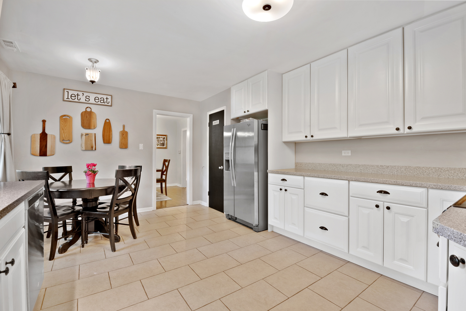 1136 Waveland Road Lake Forest, IL 60045 - Photo 8 of 18 a kitchen with granite countertop white cabinets and stainless steel appliances