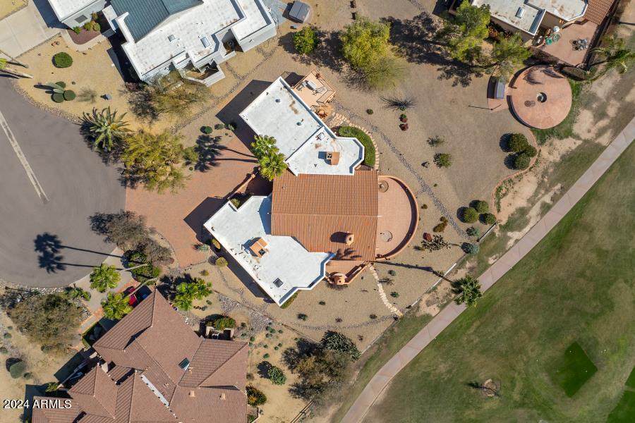 19049 East Poco Rio Drive Rio Verde, AZ 85263 - Photo 13 of 37 an aerial view of a backyard with wooden fence