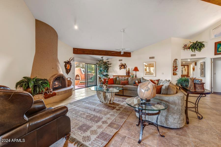 19049 East Poco Rio Drive Rio Verde, AZ 85263 - Photo 17 of 37 a living room with furniture and a potted plant