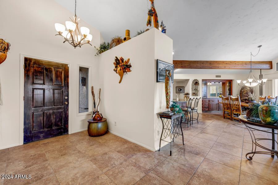 19049 East Poco Rio Drive Rio Verde, AZ 85263 - Photo 32 of 37 a view of a dining room with furniture and chandelier