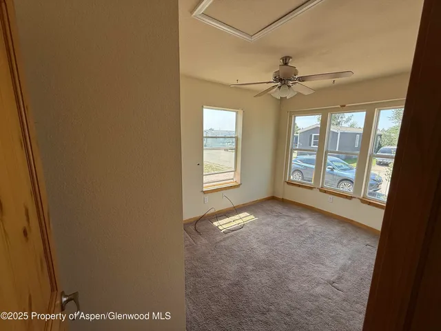 a view of an empty room with a window