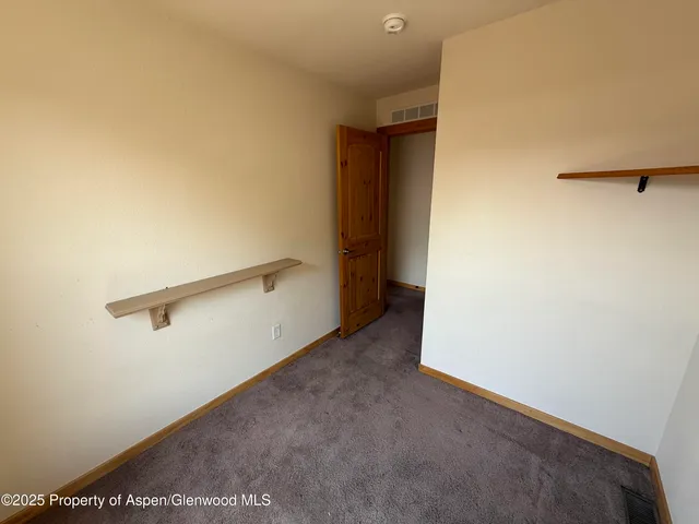 a view of a room with racks on the wall