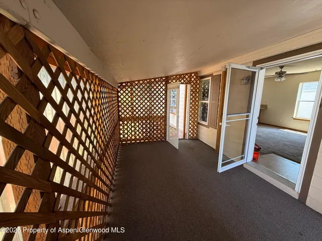 a view of a livingroom with stairs