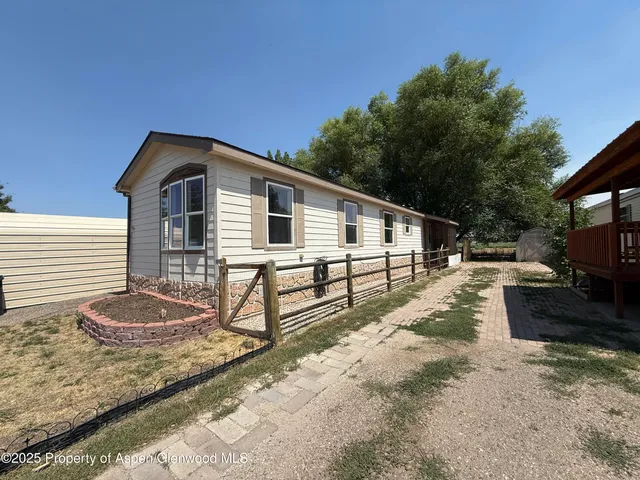 a house view with a backyard space