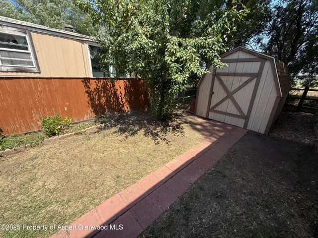 a view of a back yard of the house
