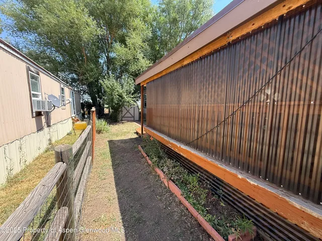 a view of balcony with wooden floor