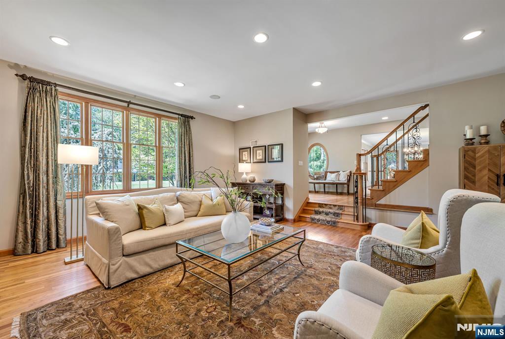 411 Snyder Road Wyckoff, NJ 07481 - Photo 4 of 36 a living room with furniture and a large window