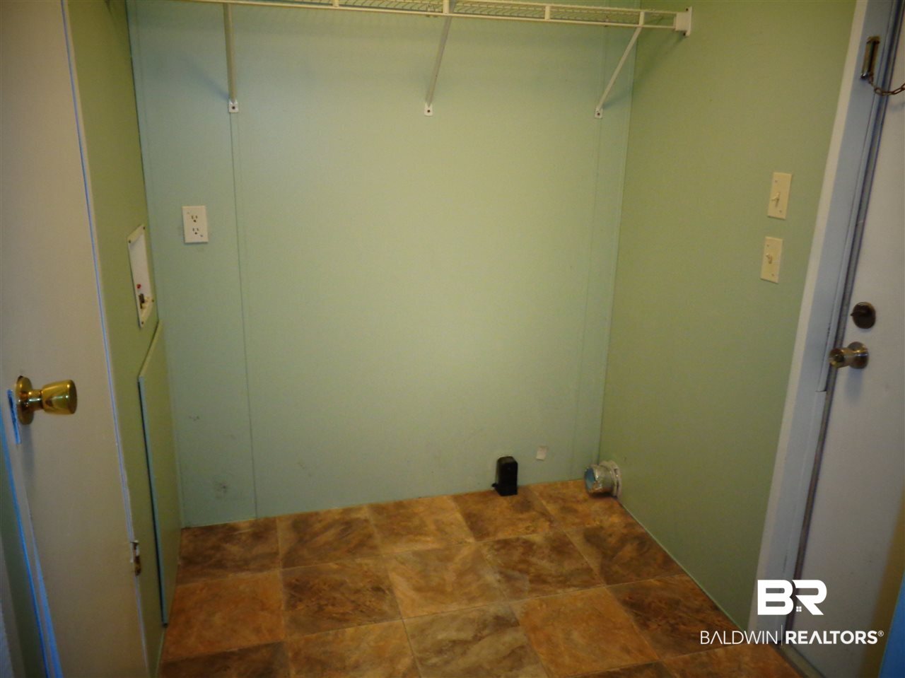 21535 A Glass And Spivey Road Robertsdale, AL 36567 - Photo 14 of 32 9x6. Pantry closet. Door to back porch/deck.