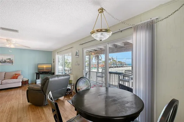 a view of a livingroom with furniture window and wooden floor