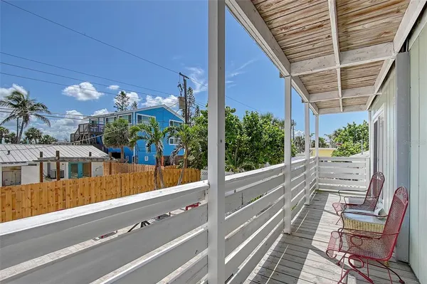 a view of balcony with a potted plant