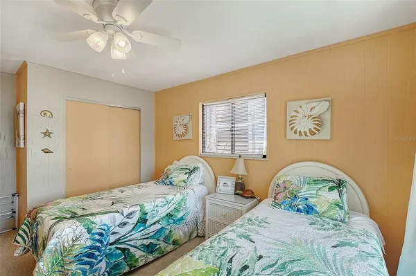 a bedroom with bed and a window