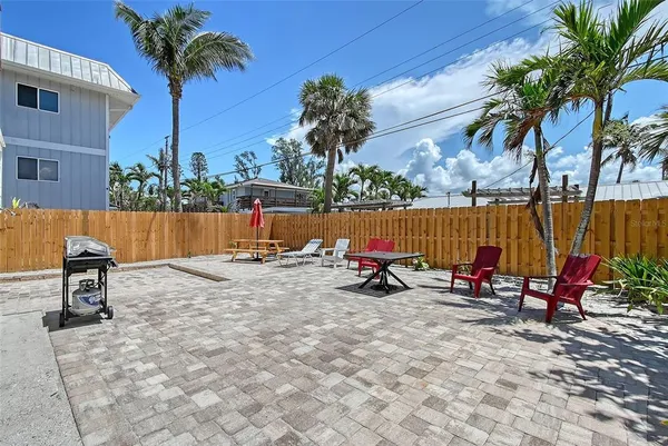 swimming pool view with a seating space