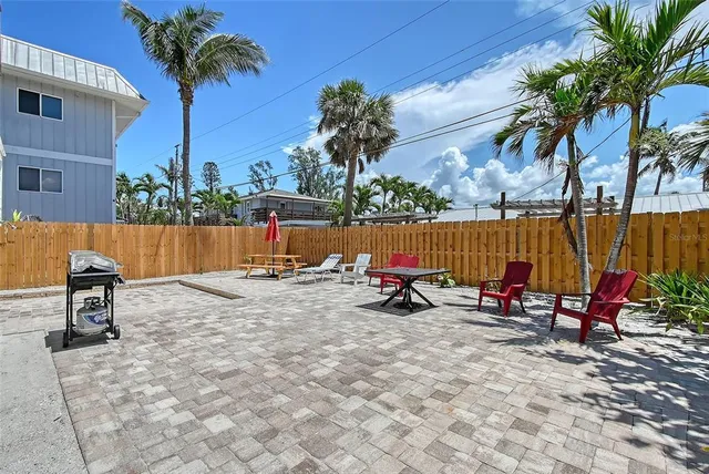 swimming pool view with a seating space