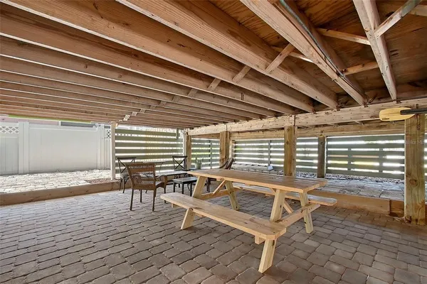 a patio with table and chairs