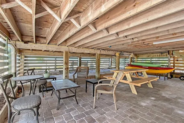 a patio with a table and chairs