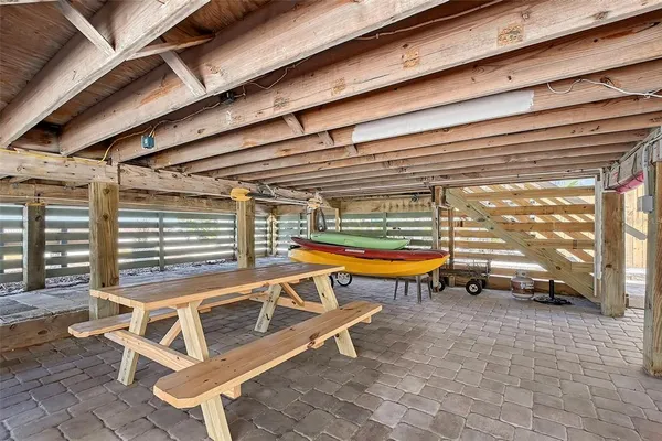 a view of a patio with a table and chairs