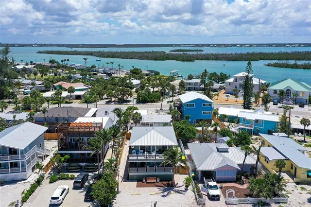 an aerial view of a building with floor to ceiling windows