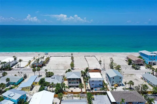 an aerial view of a house with a garden