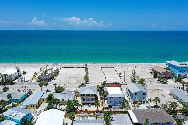 an aerial view of a house with a garden